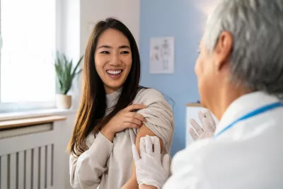 A Patient Smiles After Receiving a Flu Shot