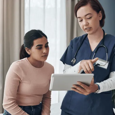 A Doctor Goes Over a Chart with her Patient