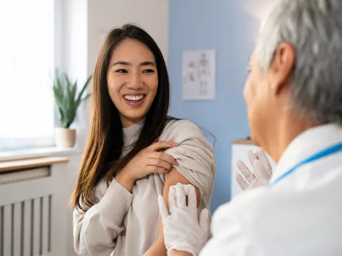 A Patient Smiles After Receiving a Flu Shot