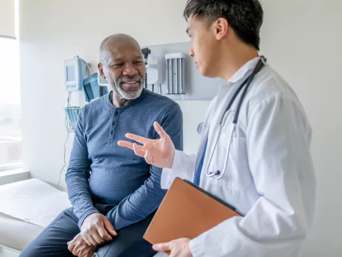 A Doctor Speaks to a Senior Couple About Their Health