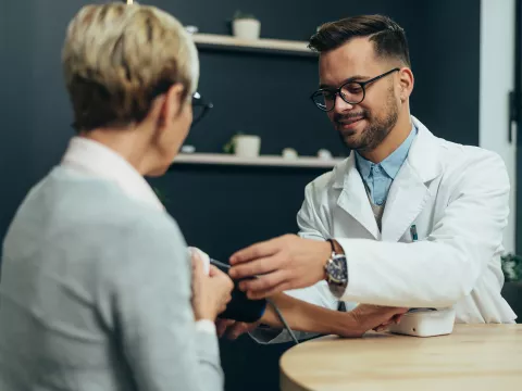 A Provider Check's a Patient's Blood Pressure