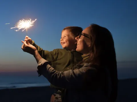 Kid holding a sparkler