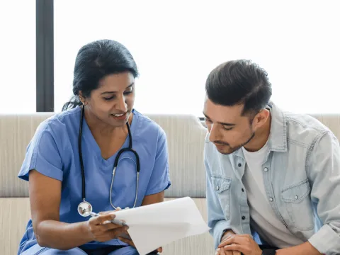 A Doctor Goes Over a Chart with her Patient
