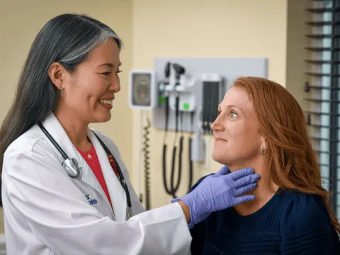 AdventHealth physician checking patient's throat