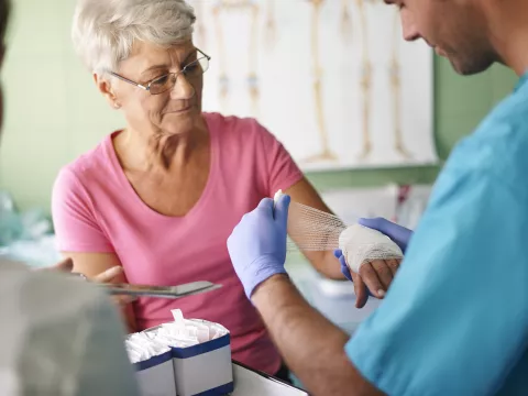 A woman receives treatment for a burn at the emergency room.