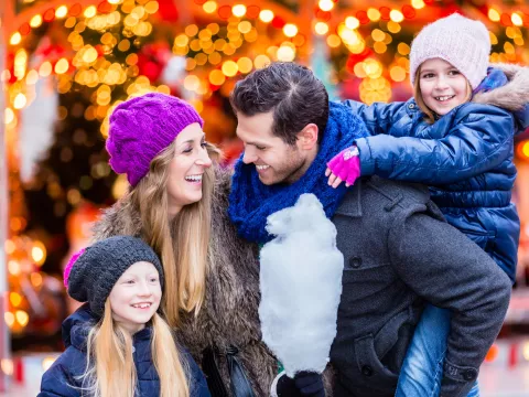 A family at a Christmas festival.