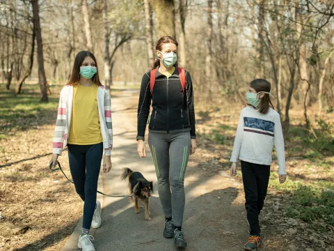 A family going for a walk in the park.