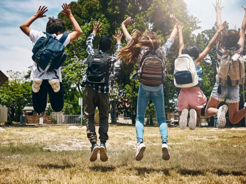 Children wearing backpacks.
