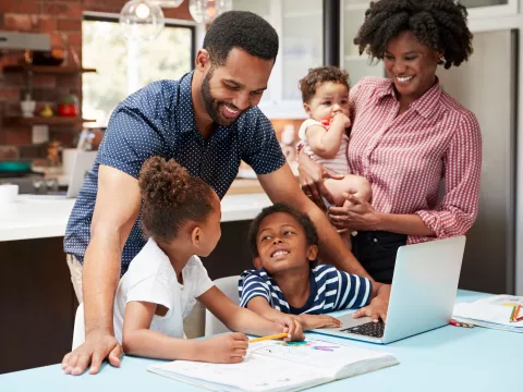 A family does homework together.