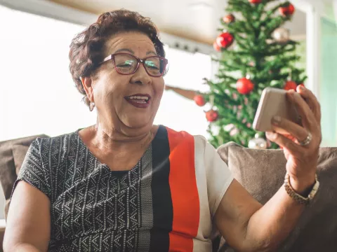 A grandmother video chatting during the holidays.