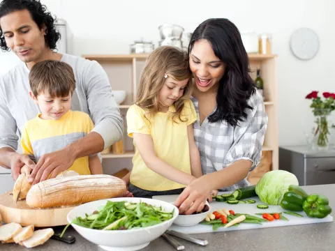 A family preparing a healthy meal.