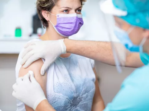 A woman getting her annual flu shot. 