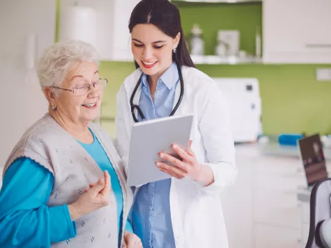 A woman reviews her test results with her doctor.