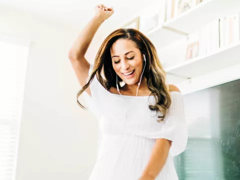 Woman listening to music with headphones on