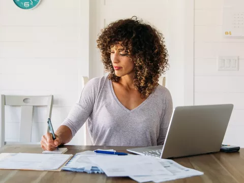 A woman working from home.