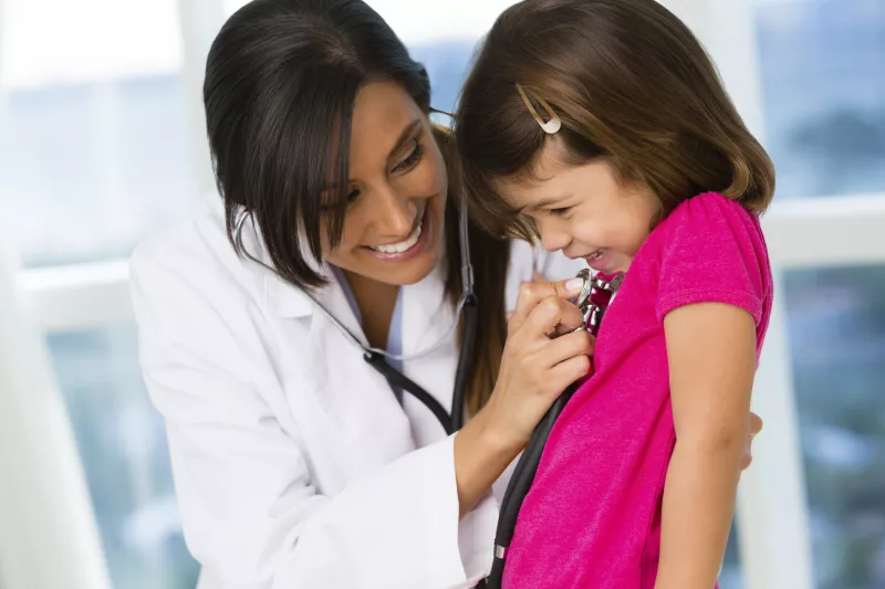 Little girl giggling at doctor's office