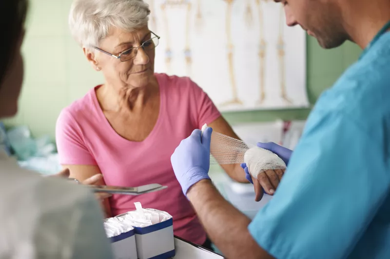 A woman receives treatment for a burn at the emergency room.