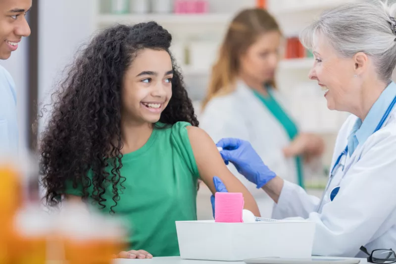 Young girl getting a flu shot