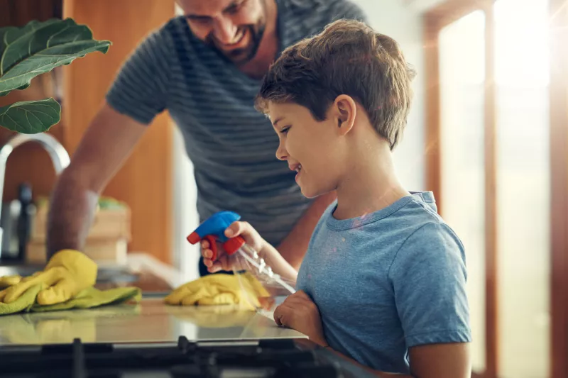 Father and Son Cleaning House