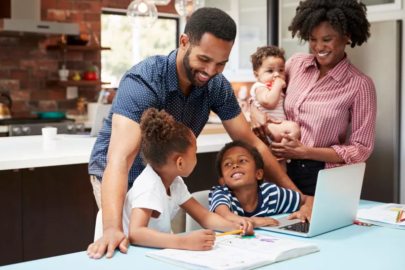 A family does homework together.