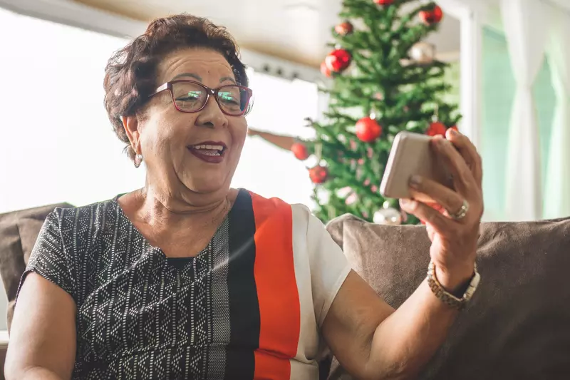 A grandmother video chatting during the holidays.