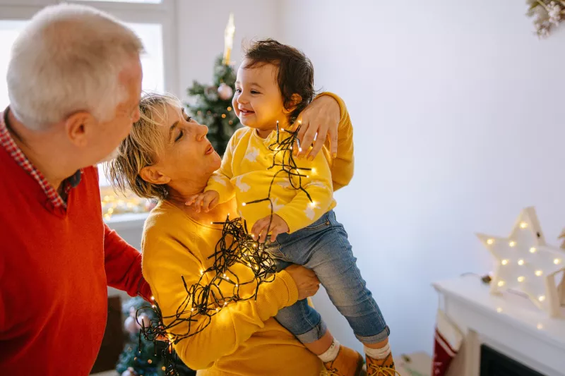 Trimming the tree with the family.