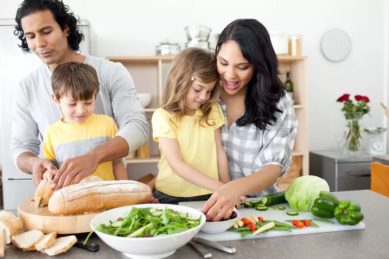 A family preparing a healthy meal.