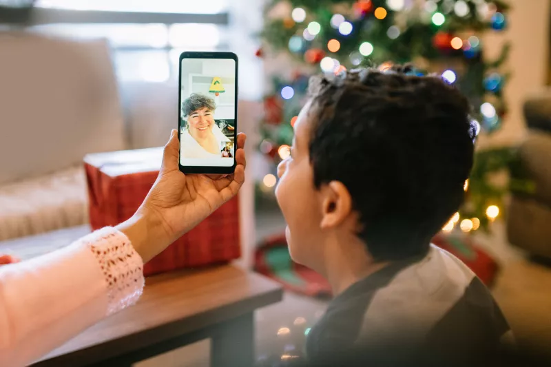 A child video chatting during the holidays.