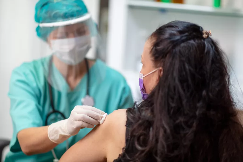 A woman getting her annual flu shot.