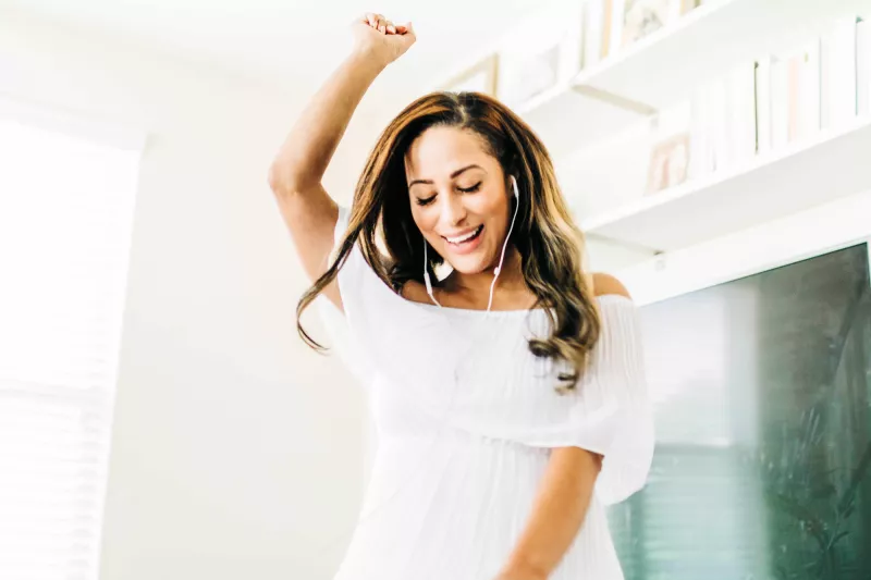 Woman listening to music with headphones on