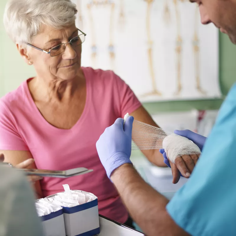A woman receives treatment for a burn at the emergency room.