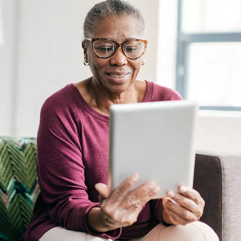 Woman reading tablet