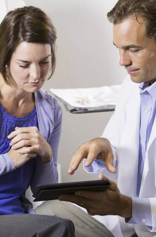 Woman reviewing chart with her doctor