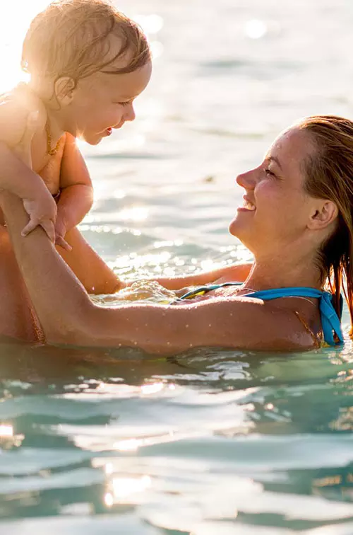 Mom and toddler in swimming pool
